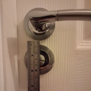 Handyman fitting new internal door handle and lock in Clitheroe residential property