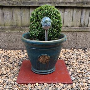 Handyman tidied up a residential garden and arranging plant pots in Ribble Valley